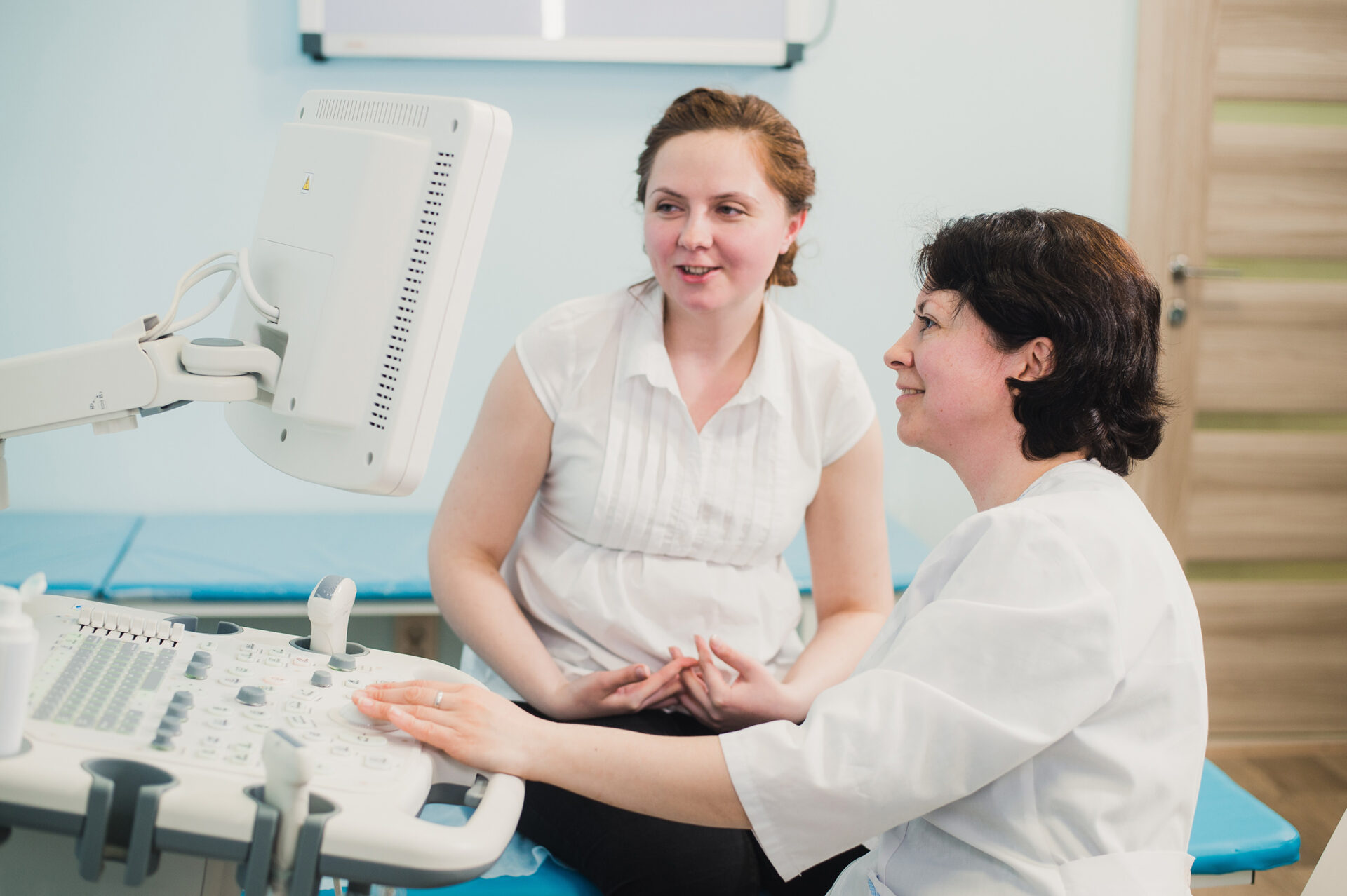 doctor and patient looking at ultrasound result